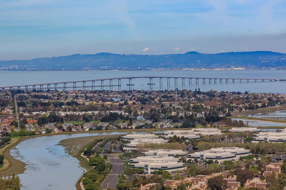 Aerial view of the San Francisco Bay with Hayward Bridge and Foster City in San Mateo County, California.